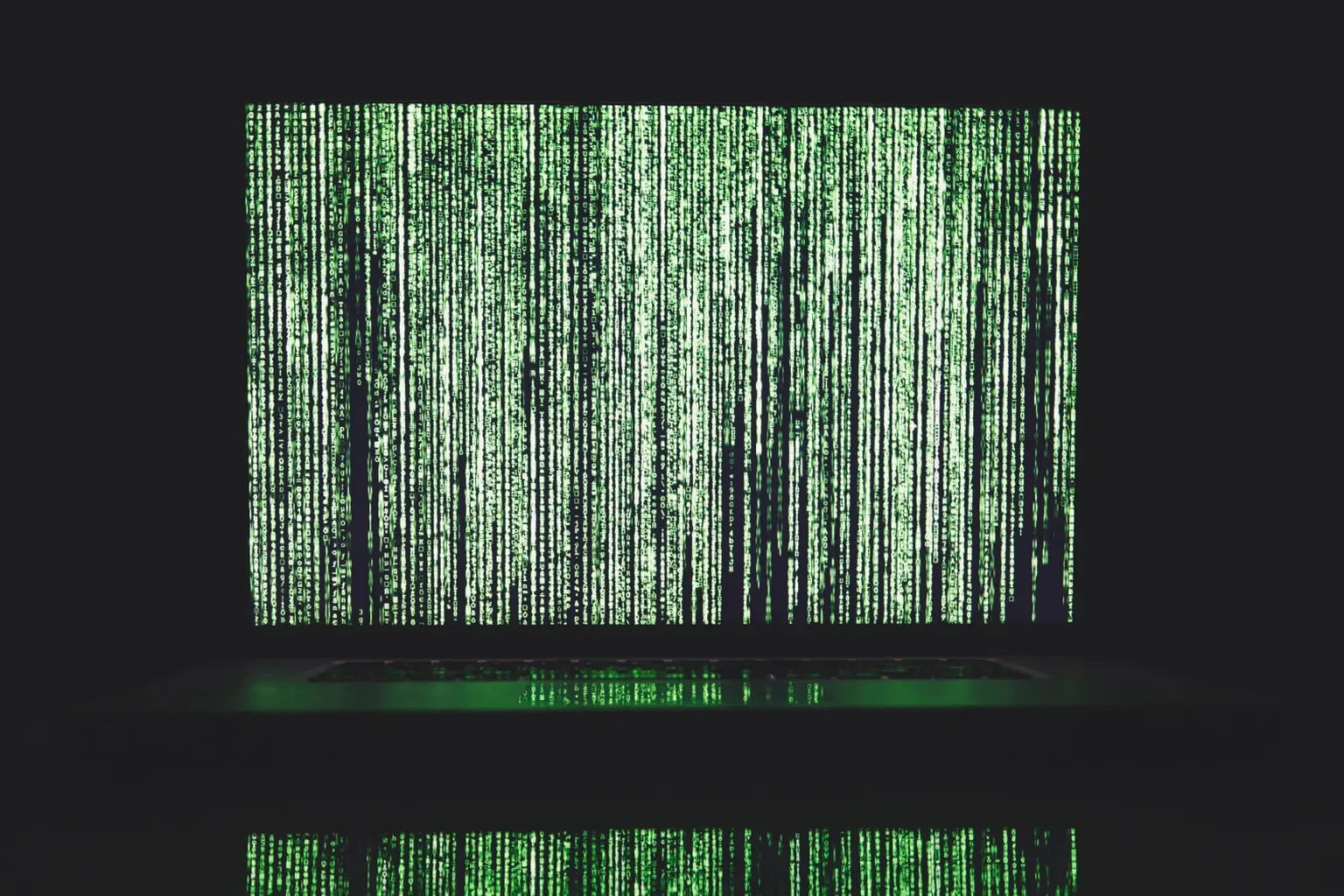 projected screen of green binary codes in waterfall cascading formation