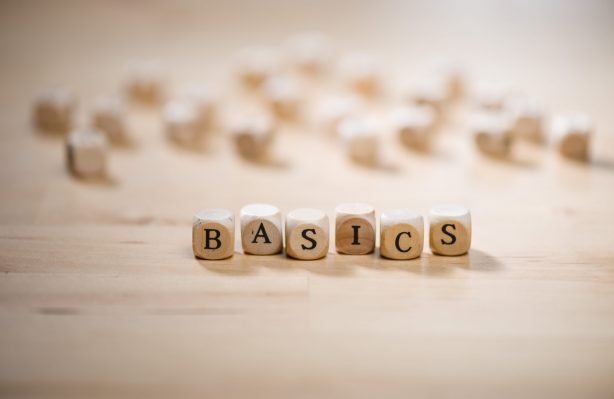 Wooden letter blocks that read the word "BASICS"