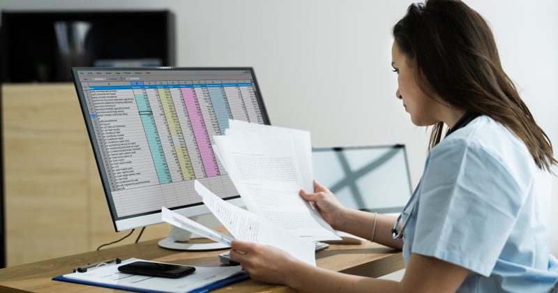 Woman performing medical coding and billing
